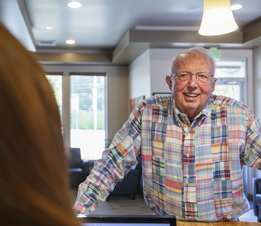 Senior man checking in at Pacific Oak Dental
