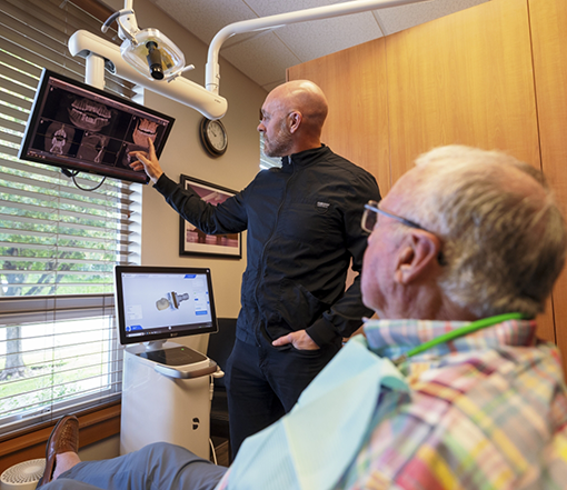 Forest Grove dentist showing a patient x rays of their teeth